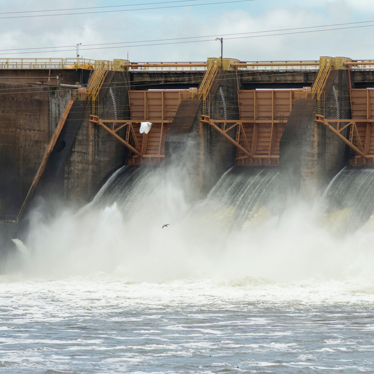 AdobeStock_572258867_dam_with_open_hydroelectric_plant_gates_Divina_Epiphania.jpg 