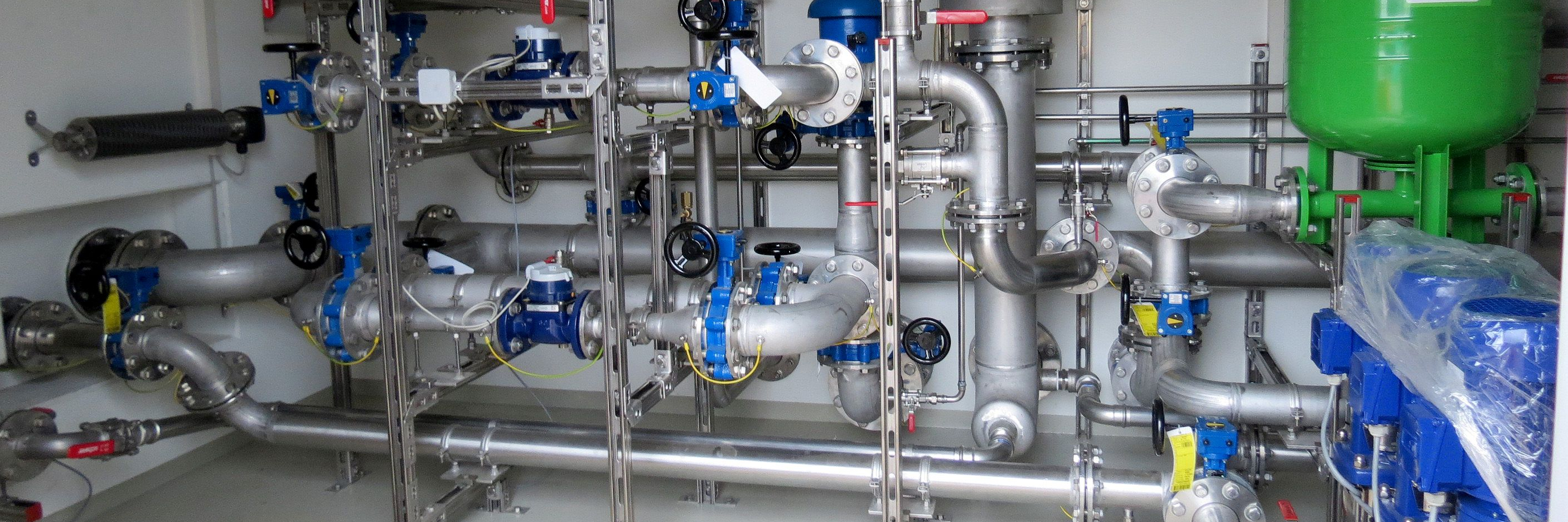 Pre-installed booster station in a utility room for a municipal water network