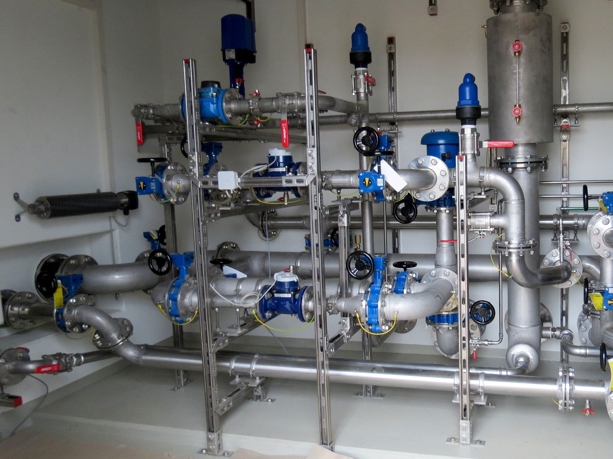 Pre-installed booster station in a utility room for a municipal water network